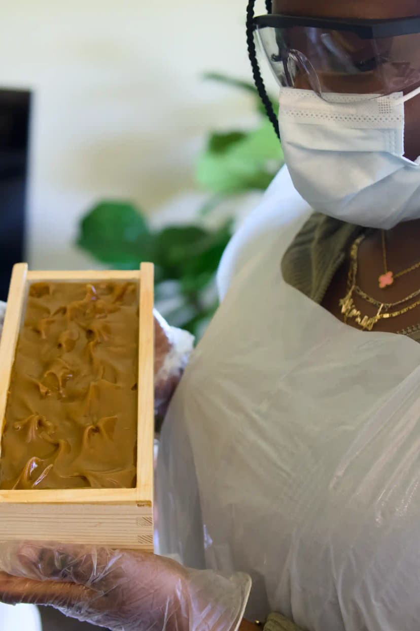 Soap workshop participant holding handmade soap